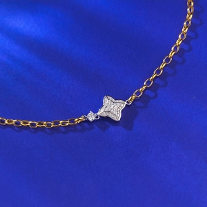 Elegant gold S925 silver bracelet featuring a double-sided four-pointed star with pavé diamonds