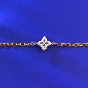 Modern two-tone S925 silver bracelet featuring a four-pointed star pendant on a gold chain