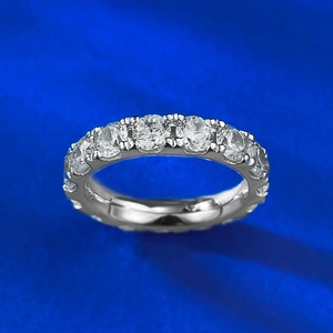 Detailed macro view of S925 sterling silver band with sparkling round pavé-set diamonds
