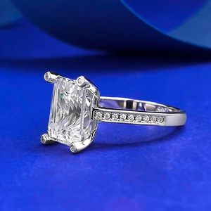 Macro shot of S925 silver emerald cut ring featuring sparkling micro-pave stones