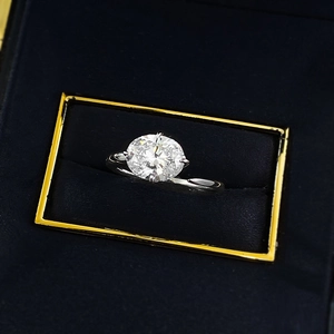 Macro shot of an oval solitaire silver ring displayed in a luxury gift box