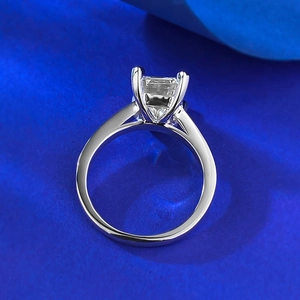 Detail view of emerald cut square moissanite stone in four-prong S925 silver setting