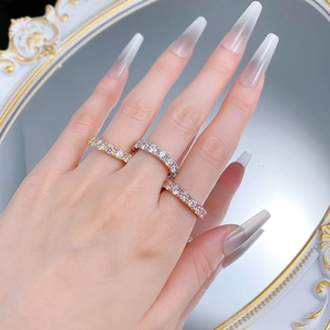 Three-color S925 sterling silver eternity rings with round diamonds on woman's hand