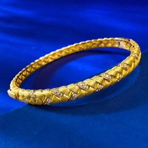 Elegant gold woven S925 silver bracelet with frosted texture and sparkling stones