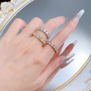 Detailed view of S925 silver eternity rings in silver, gold and rose gold with zircon stones