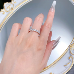 Macro shot of S925 silver ring featuring 4mm round-cut stones in a full eternity setting