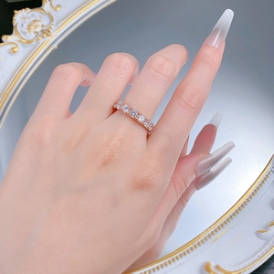 Close-up of rose gold silver band with round cut pave set cubic zirconia stones