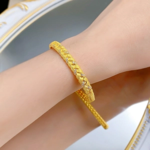 Macro shot of S925 gold-plated wheat grain weave bracelet with micro-inlaid stones