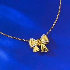 Elegant gold-plated S925 silver bow pendant necklace with sparkling diamond accents