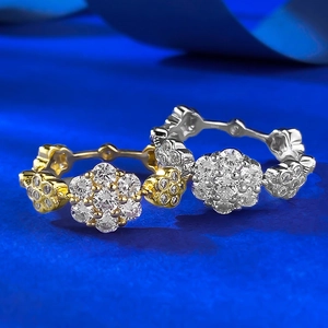 Detailed macro shot of S925 sterling silver flower rings in gold and silver finishes
