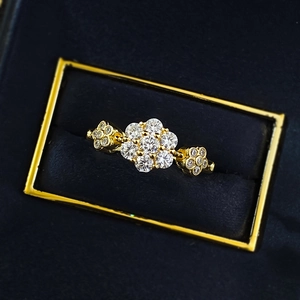 S925 silver gold-plated ring with three flower cluster zircons on blue velvet