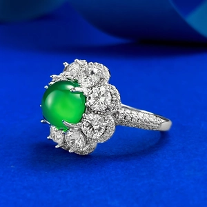 Detailed side view of S925 silver ring with green chalcedony cabochon and crystal halo