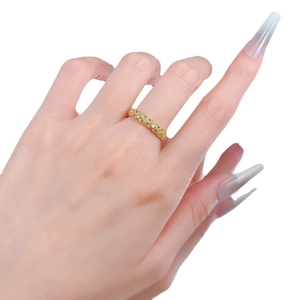 Vintage S925 silver hollow lace ring with diamonds in gold finish worn by a model
