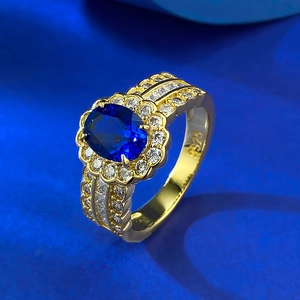 Elegant S925 silver oval blue sapphire ring with halo diamonds shown in a 45-degree view