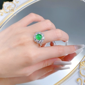 Close-up of S925 silver ring with 8mm green chalcedony and flower cluster of cubic zirconia