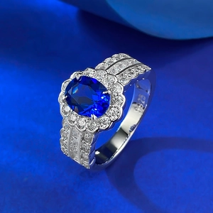 Elegant S925 silver halo ring featuring an oval sapphire centerpiece and side diamonds