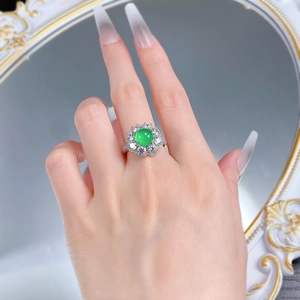 Close-up of S925 silver ring featuring a green chalcedony stone and halo diamond setting