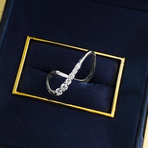 Macro shot of S925 sterling silver wave ring with zircons in blue velvet box