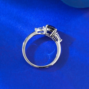 Three-stone S925 silver ring featuring blue sapphire and marquise side crystals