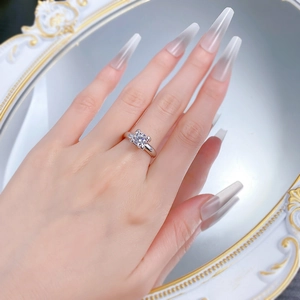 Macro view of princess cut solitaire diamond ring with four-prong silver setting
