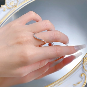 Detailed view of wave-shaped S925 silver ring with sparkling micro-pave zirconia stones
