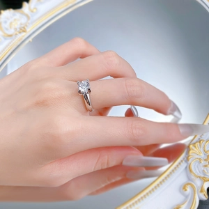 Close-up of S925 silver four-prong ring with a brilliant round-cut diamond solitaire