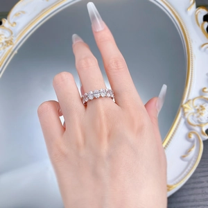 Macro detail of S925 silver eternity ring with oval-cut crystals in a claw setting