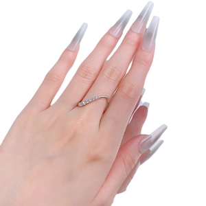 Minimalist S925 silver wave ring featuring a curved band set with sparkling zircons