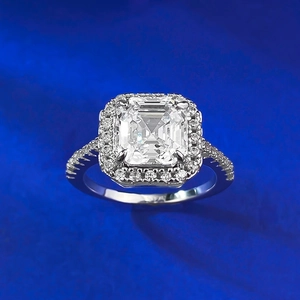 Macro view of Asscher cut zircon ring with halo setting and micro-pave band detail