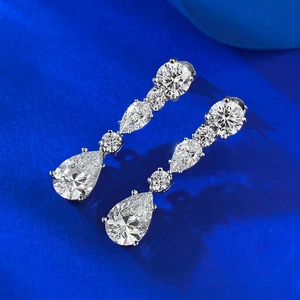 Elegant S925 silver long drop earrings featuring 8x12mm pear cut stones on blue silk