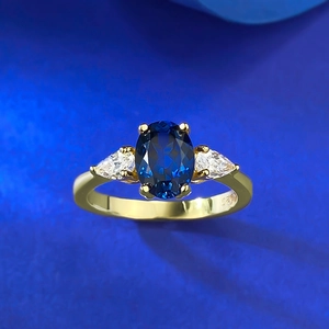 Elegant S925 silver ring featuring oval blue sapphire and pear-cut side stones
