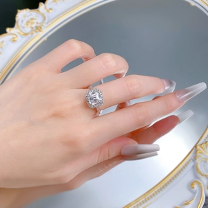Close-up of S925 silver Asscher cut cubic zirconia halo ring on finger