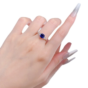 Elegant S925 silver ring featuring a square blue sapphire and side accent stones