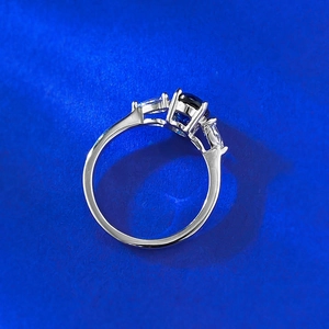 Elegant S925 silver ring featuring an oval blue sapphire and marquise side stones