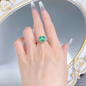Detailed view of an S925 silver ring featuring a square emerald and shimmering zircons