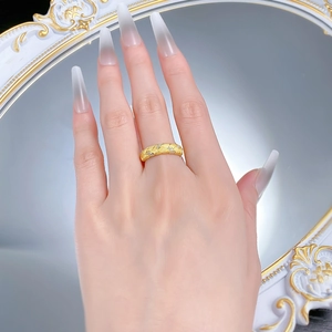 Detail of gold-plated S925 silver ring featuring woven brushed texture and tiny zircons