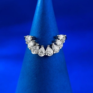 Detailed view of a V-shaped S925 silver ring featuring nine pear-cut white gemstones