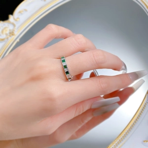 Close-up of S925 silver ring with princess cut green and white zircon stones