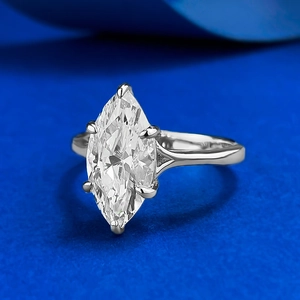 925 silver marquise-cut 7x14mm diamond ring with six-prong setting on deep blue surface