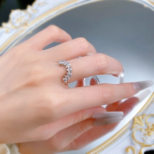 Detail of S925 silver stacking ring with pear-cut stones in a crown shape