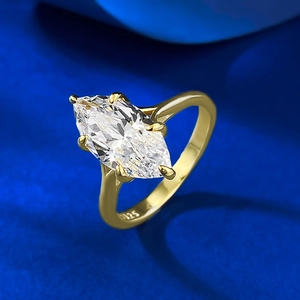 Marquise-cut crystal ring in 925 sterling silver gold plating on blue silk background