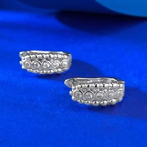 Close-up of S925 sterling silver hoop earrings with five sparkling inlaid zircons