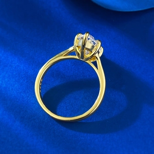 925 silver gold plated marquise ring with brilliant cut stone on blue velvet background