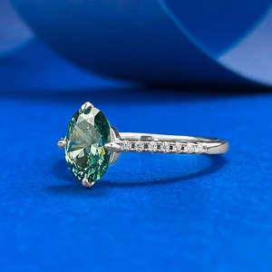 Detailed close-up of oval green tourmaline gemstone ring in 925 silver four-prong setting