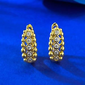 Elegant gold S925 silver huggie earrings with beaded texture and five sparkling cubic zirconia