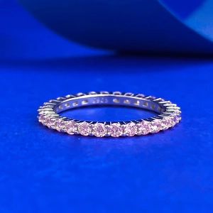 Minimalist S925 sterling silver ring with delicate pink pavé stones on blue background
