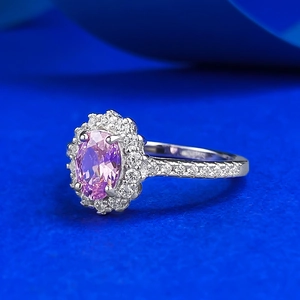 Classic S925 silver halo ring with oval pink gemstone and shimmering side stones