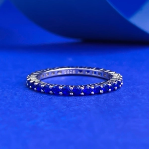 Macro shot of S925 sterling silver ring with blue zircon stones and S925 engraving