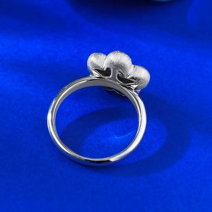 Macro detail of S925 silver ring featuring brushed matte finish and flower petal design