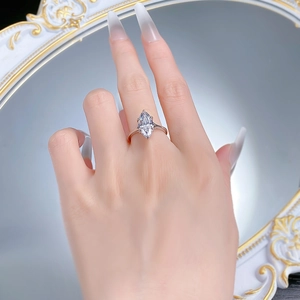 Detail of 925 silver marquise cut ring worn by a model with elegant mirror reflection
